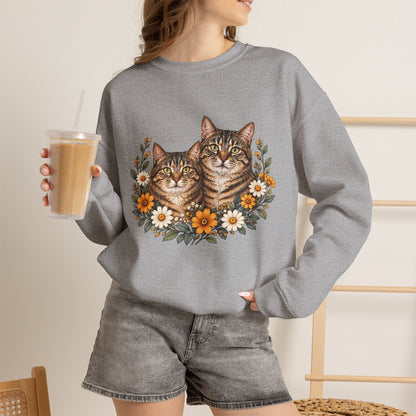 Two tabby cats and wildflowers printed on a black unisex crewneck sweatshirt