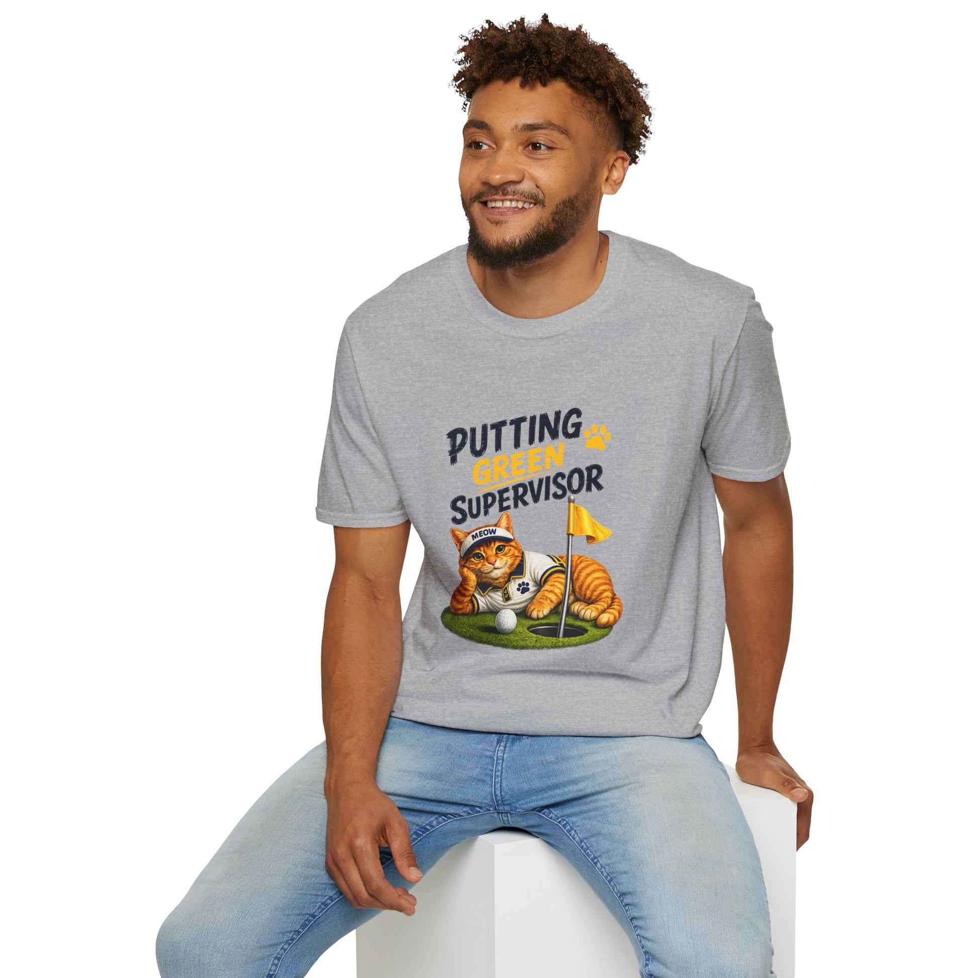 A man wearing a heather gray graphic t-shirt with a cartoon tiger on a golf green and the text 'PUTTING GREAT SUPervisor'.