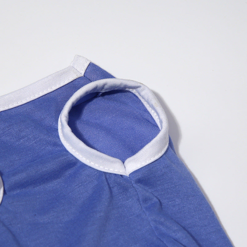 Blue garment with white trim on a light gray background