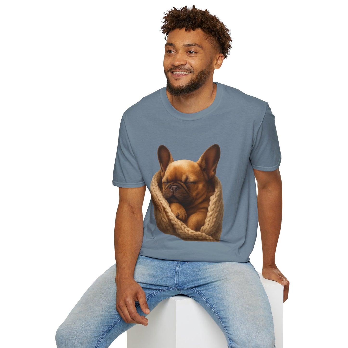 Man wearing a blue t-shirt with a dog graphic on a white background