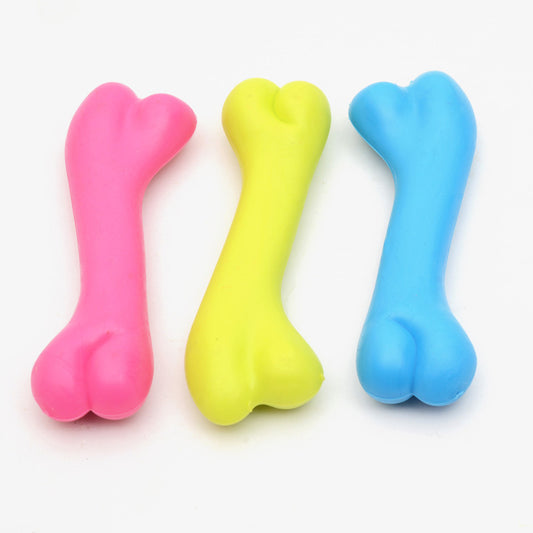 Three colorful bone-shaped toys on a white background