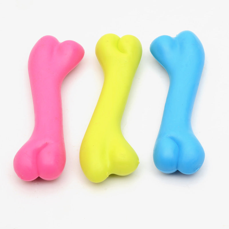 Three colorful bone-shaped toys on a white background