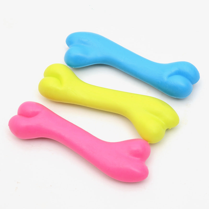 Three colorful bone-shaped objects on a white background