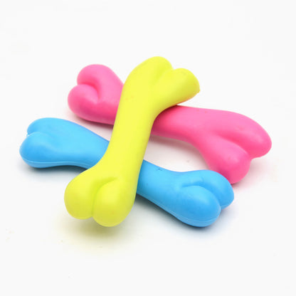 Colorful silicone dog toys on a white background