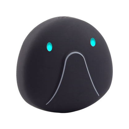 Black elephant-shaped object with glowing eyes on a white background