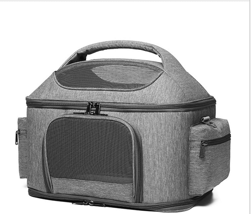 Gray pet carrier with mesh window on a white background