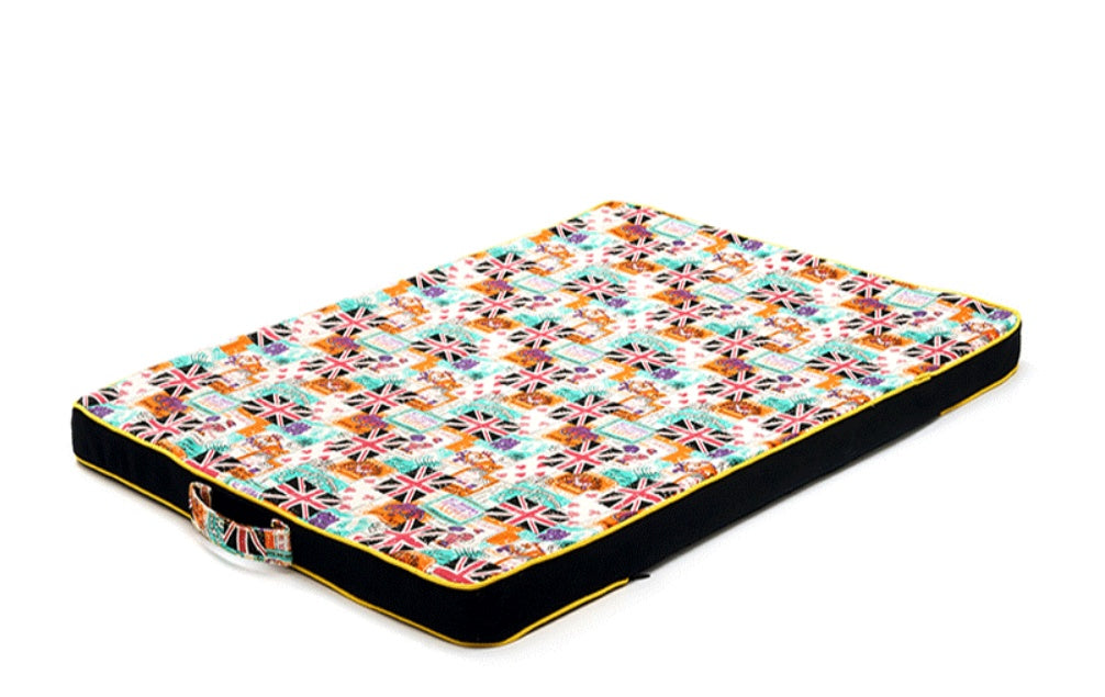 Colorful patterned pet bed on a white background
