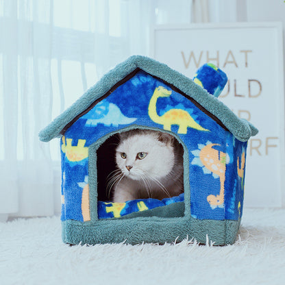 Cat inside a blue pet house with dinosaur patterns on a light background