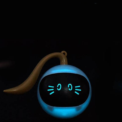 Toy snail with a glowing blue face on a black background