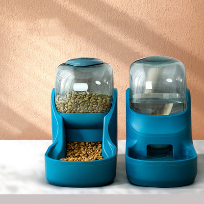 Two blue pet feeders with food on a light background