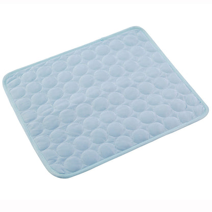 Light blue quilted bath mat on a white background