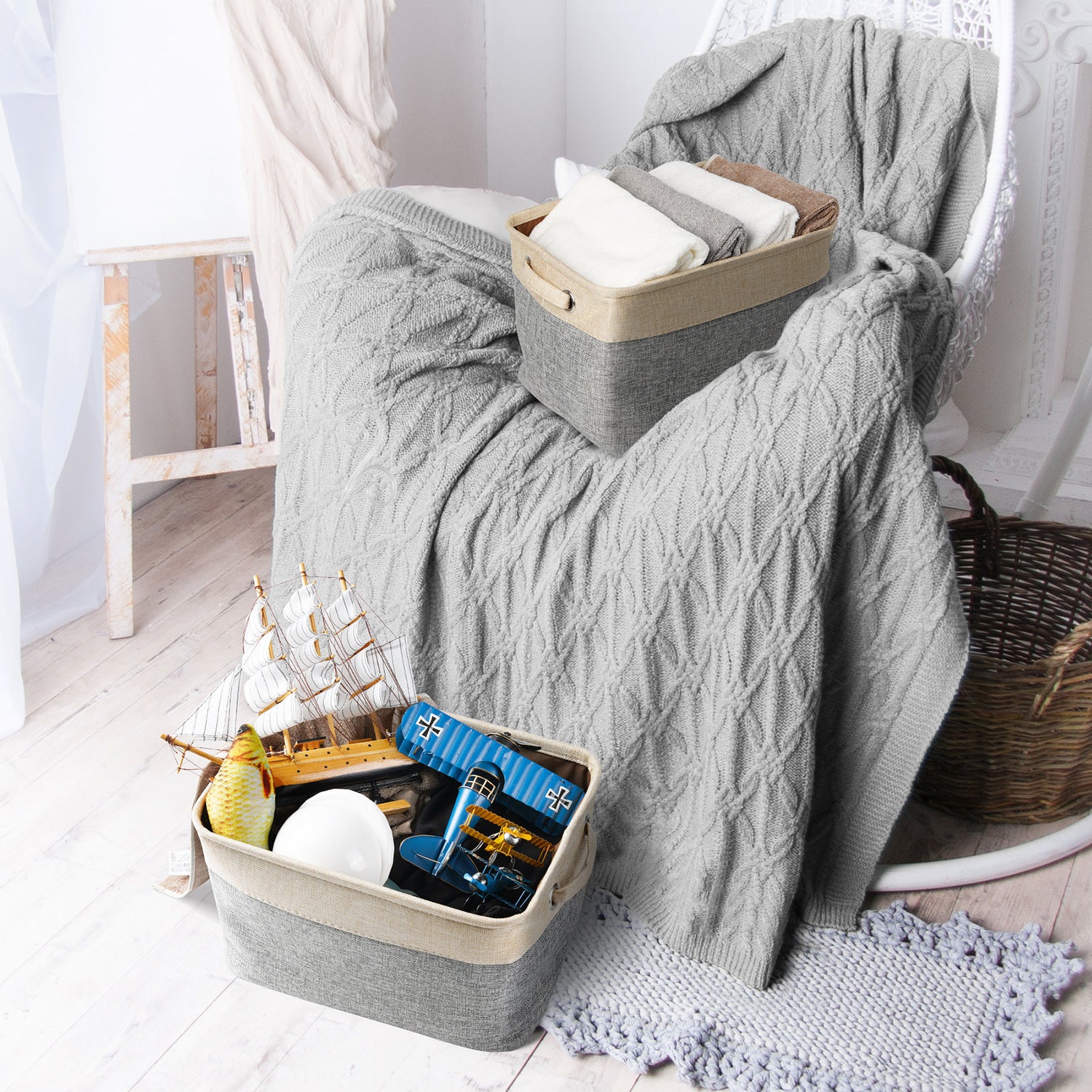 Gray textured blanket draped over a chair with toys in a basket below.