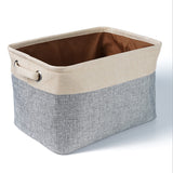Storage basket with beige top and gray bottom on a white background