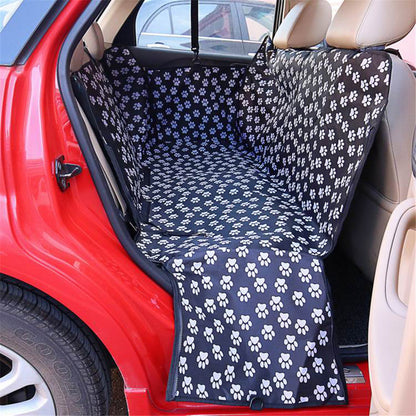 Car seat cover with paw pattern inside a red car