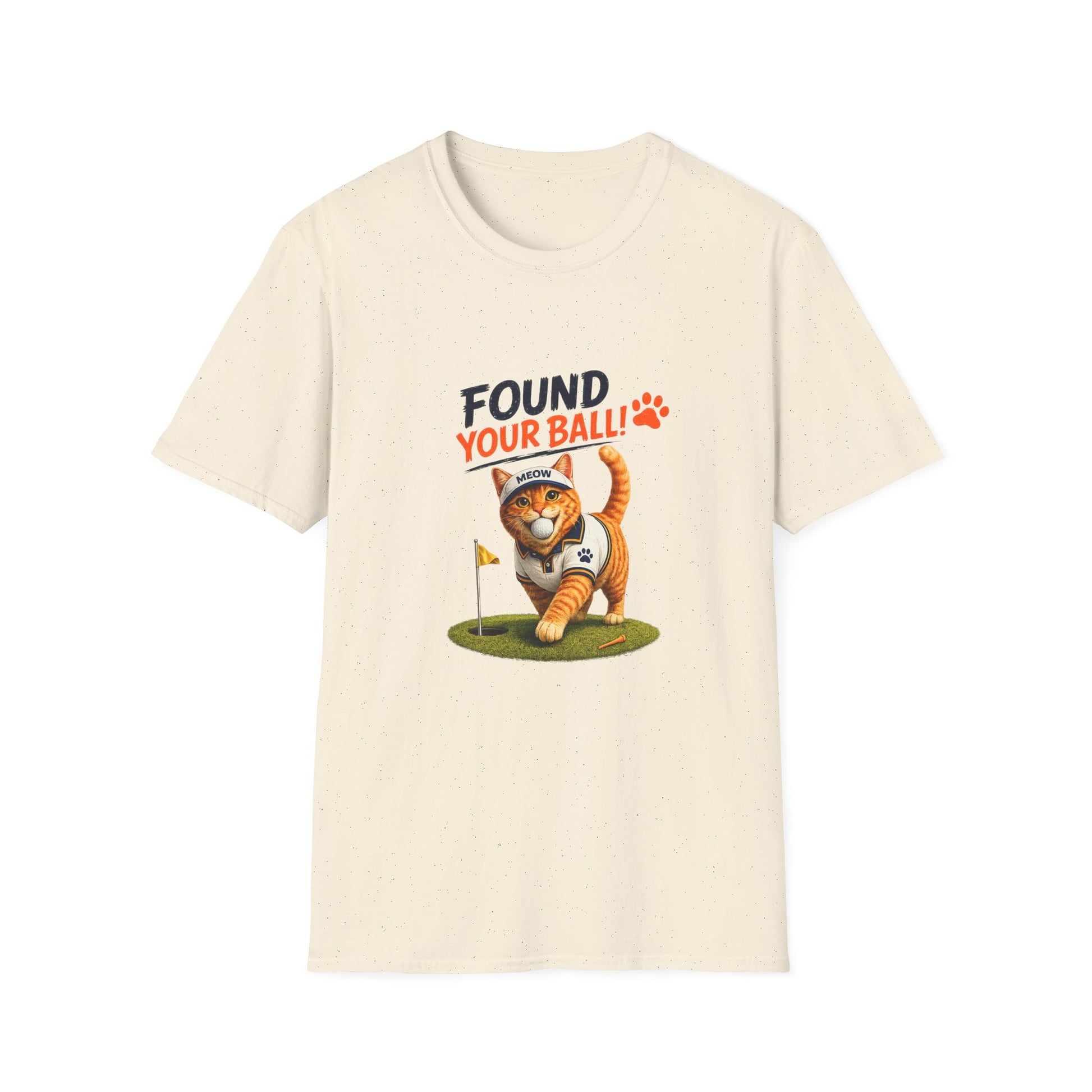 An off-white short-sleeve crewneck t-shirt featuring a cartoon graphic of an orange tabby cat wearing a golf ball cap and walking toward a hole flag, with the text 'FOUND YOUR BALL!' in black and orange above it.