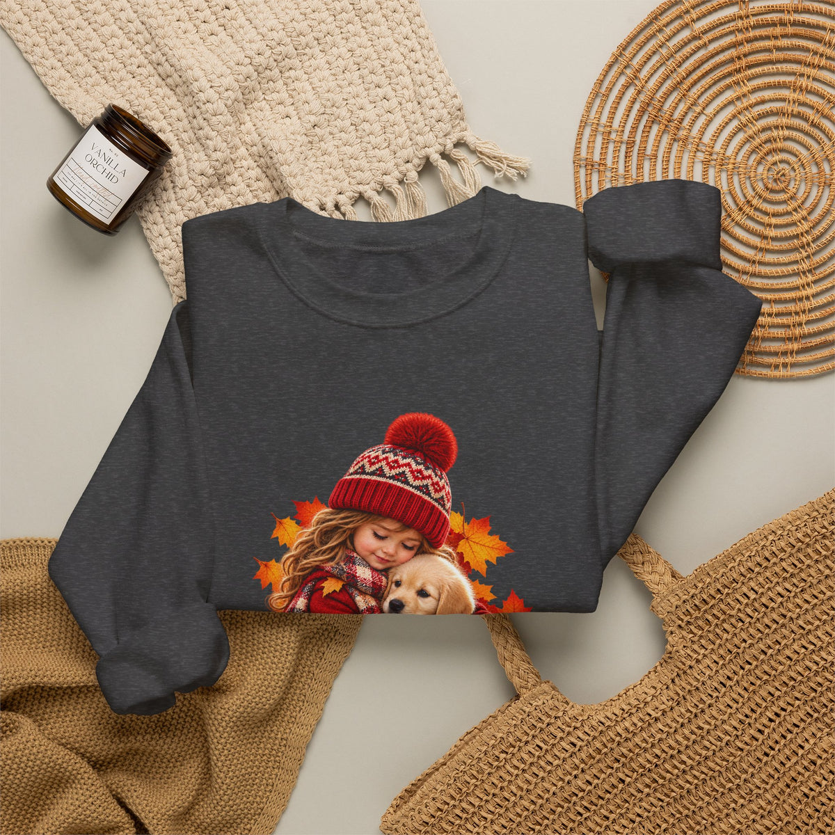 Folded dark heather Golden Moments girl and puppy sweatshirt styled with neutral knit accessories