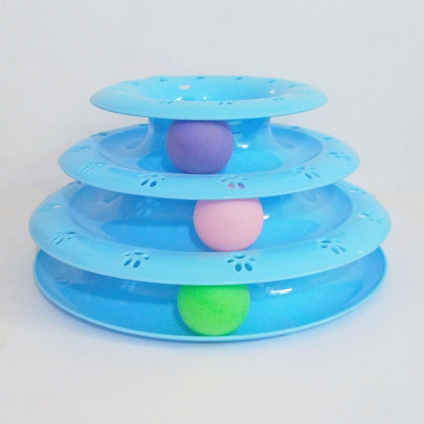 Three-tiered blue pet toy with colorful balls on a white background