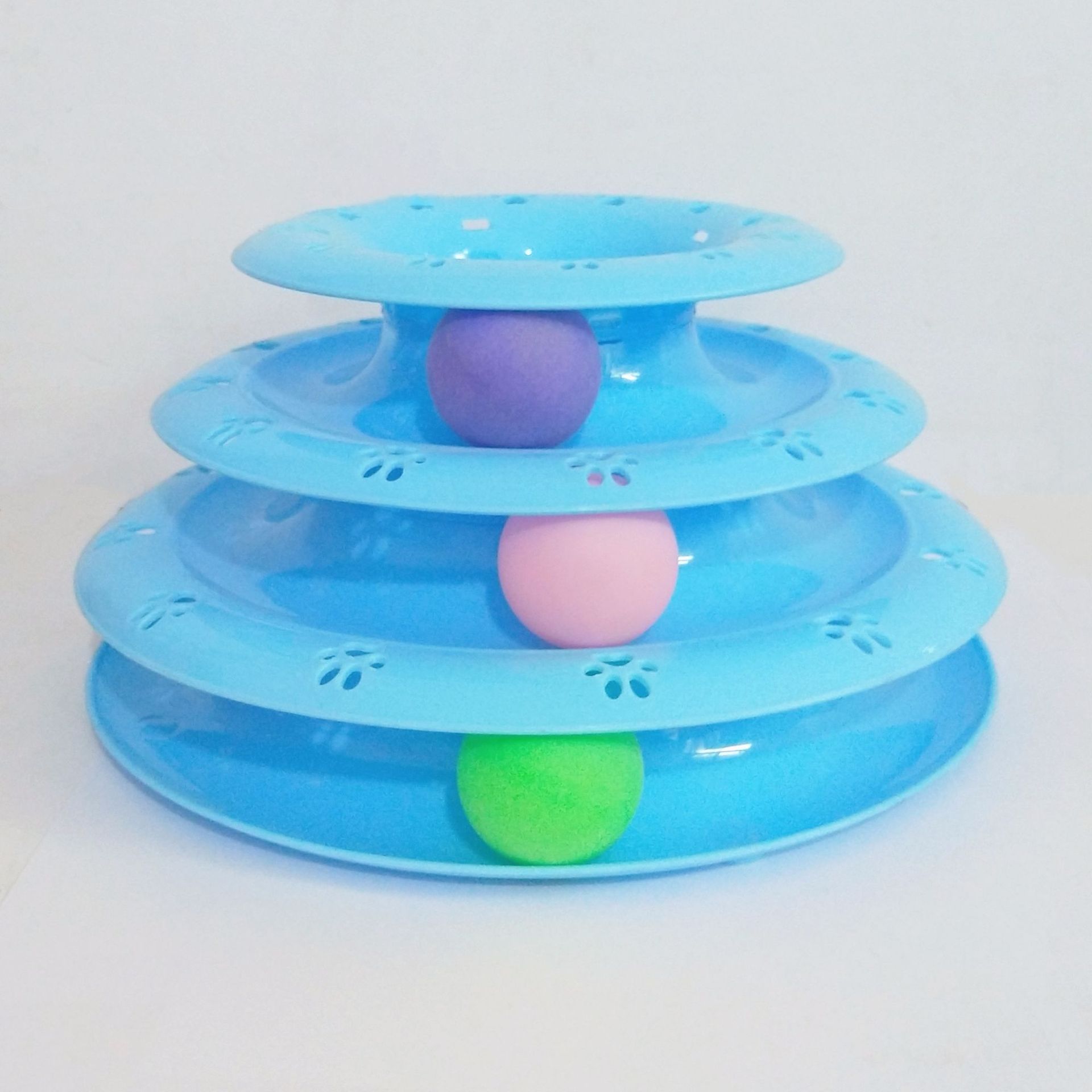 Three-tiered blue pet toy with colorful balls on a white background
