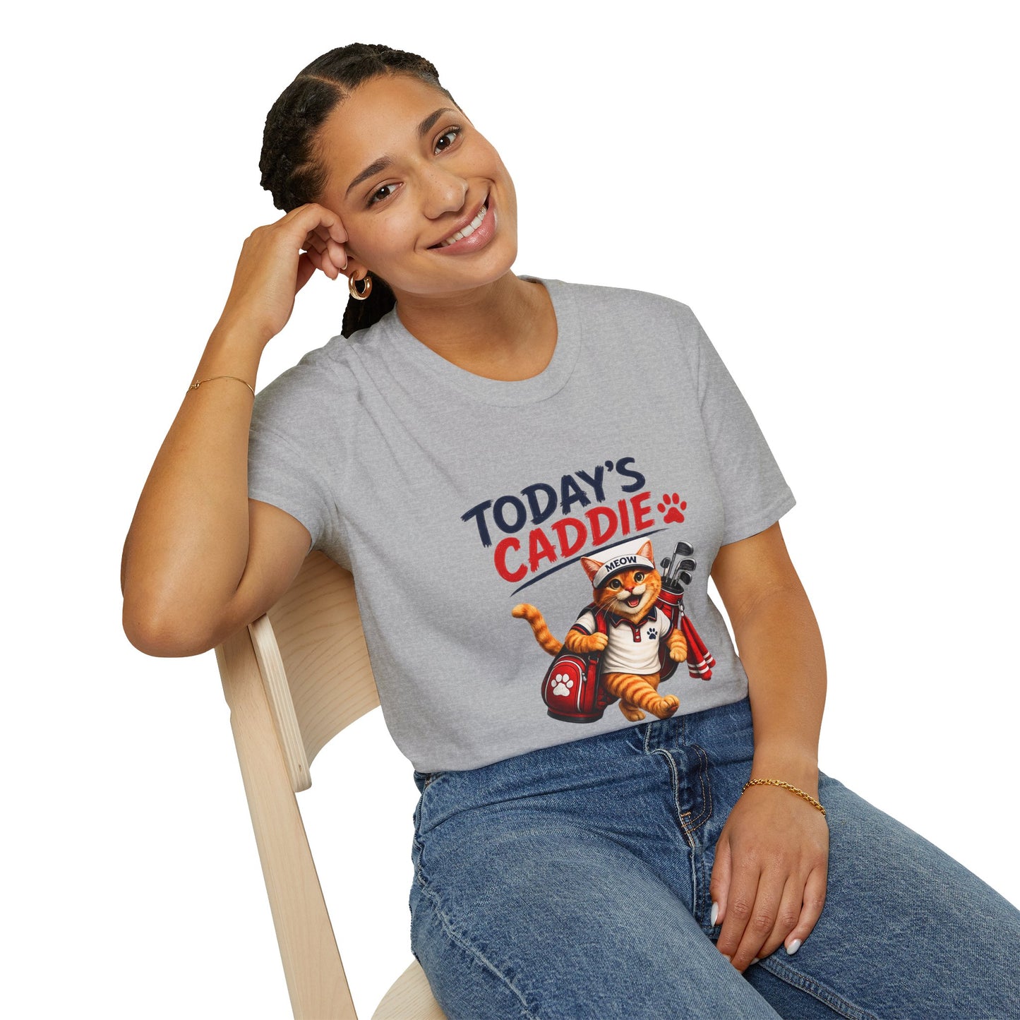 An sport grey short-sleeve crewneck t-shirt featuring a cartoon graphic of an orange tabby cat wearing a cap and holding golf clubs, with the text 'TODAY'S CADDIE' 