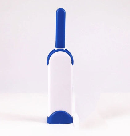 White and blue pet grooming brush on a white background