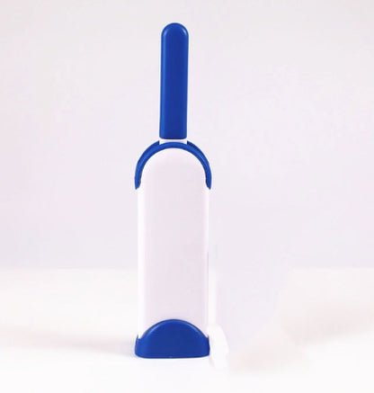 White and blue pet grooming brush on a white background