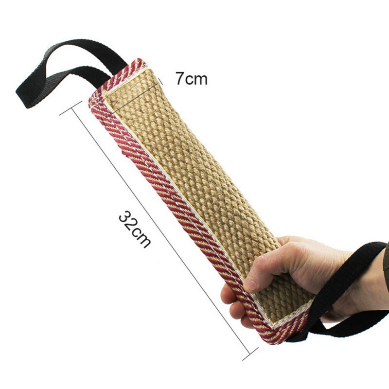 Hand holding a jute and rope chew toy with measurements on a white background