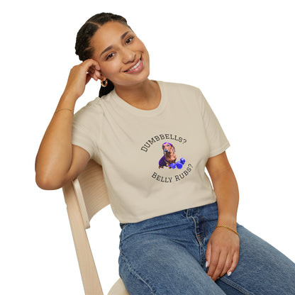 Person wearing a beige t-shirt with a graphic and text, sitting on a chair.
