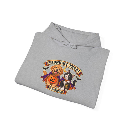 A folded light gray hoodie on a white background, featuring a colorful graphic print of a golden retriever and a black cat dressed as superheroes under a banner that reads 'Midnight Treat Patrol'.