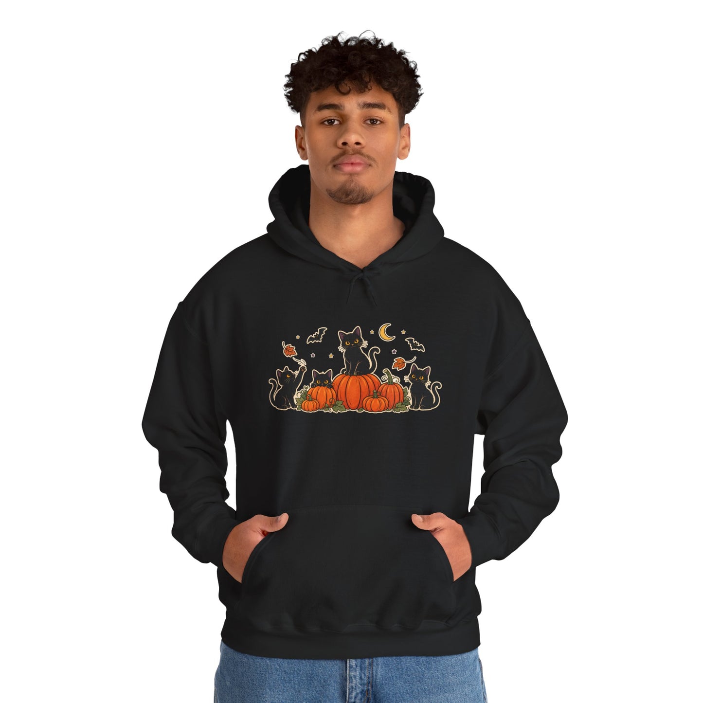 A black pullover hoodie with a front graphic of black cats sitting on orange pumpkins, surrounded by small bats, leaves, and a crescent moon, shown on a plain white background.