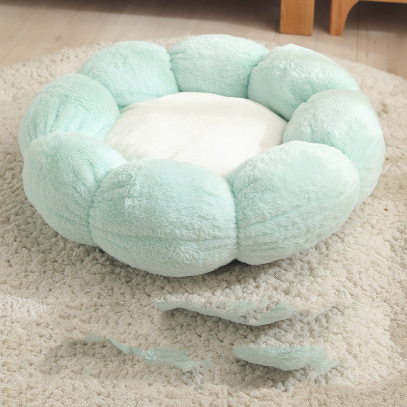 Light blue pet bed on a carpeted floor