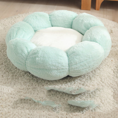 Light blue pet bed on a carpeted floor