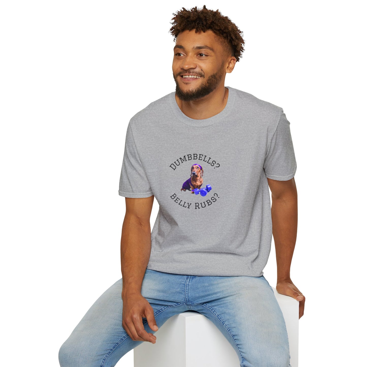 Man wearing a gray t-shirt with 'Overcomer' design sitting on a white stool against a white background