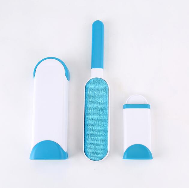 Set of three blue and white grooming tools on a light gray background
