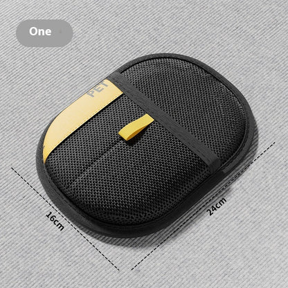 Black mesh pouch with gold accent on a gray background