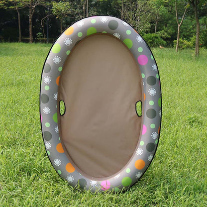Inflatable playpen with colorful polka dot design on grass