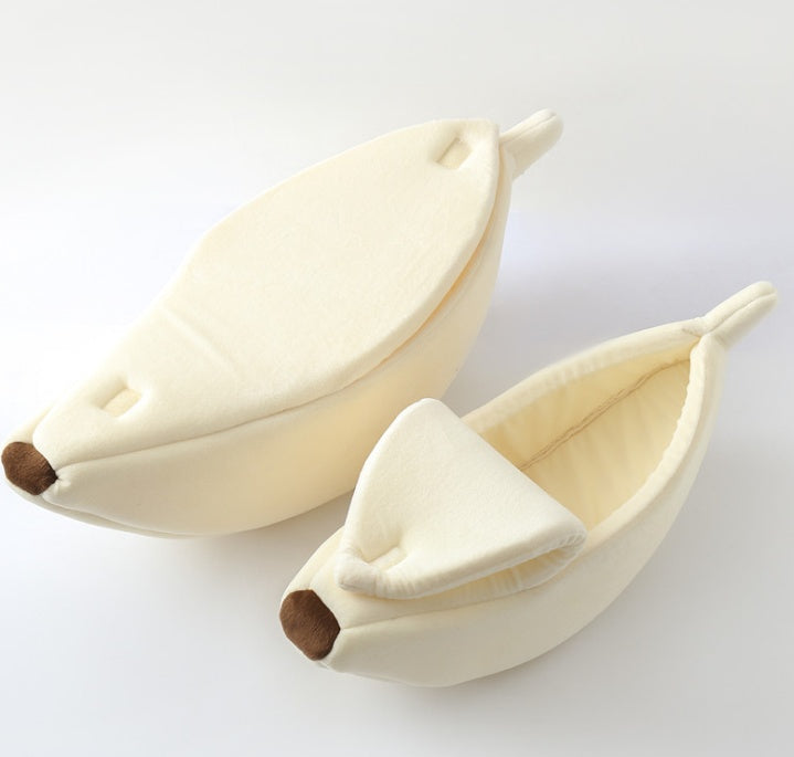 Two banana-shaped pet beds on a white background
