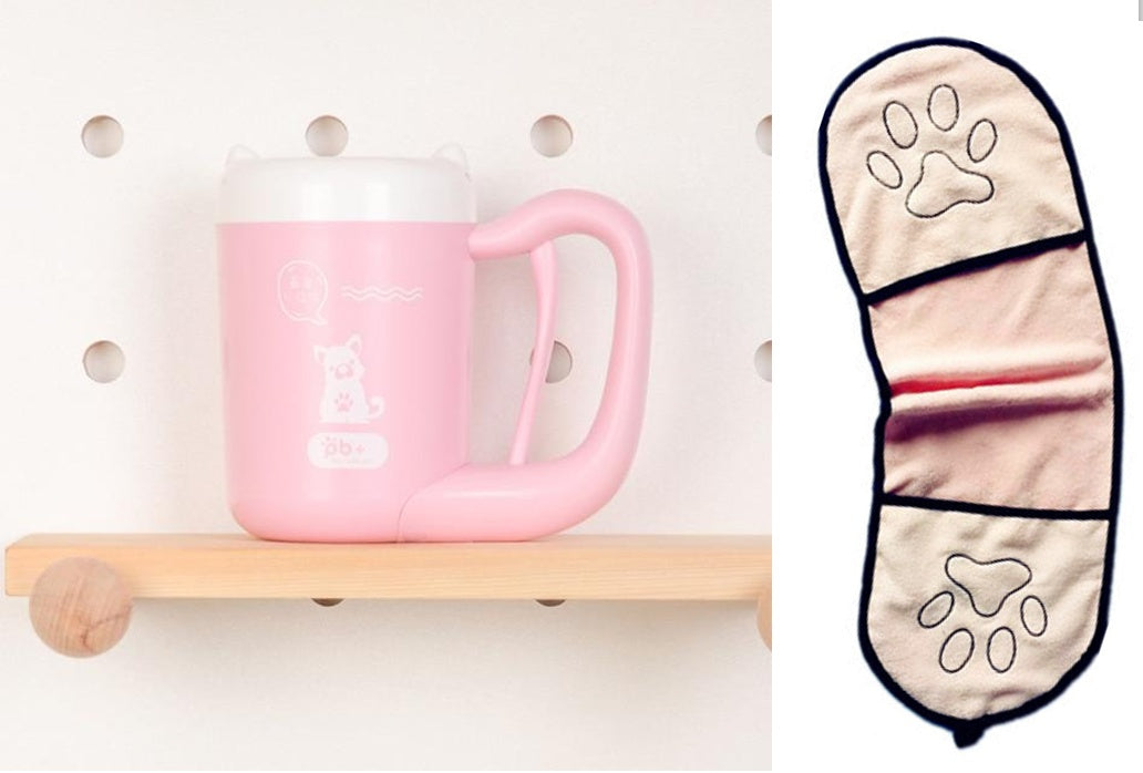 Pink mug on a wooden shelf with a paw print design oven mitt next to it.