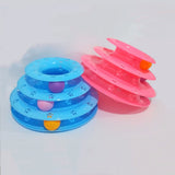 Blue and pink pet toy with three stacked rings on a white background