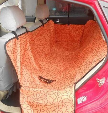 Orange car seat cover with a textured pattern on a red car interior.