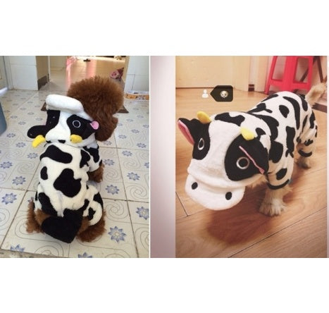 Dog wearing a cow-themed costume on a tiled floor and wooden floor.