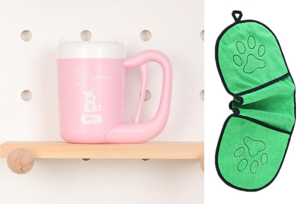 Pink mug on a wooden shelf with a green paw print oven mitt next to it.