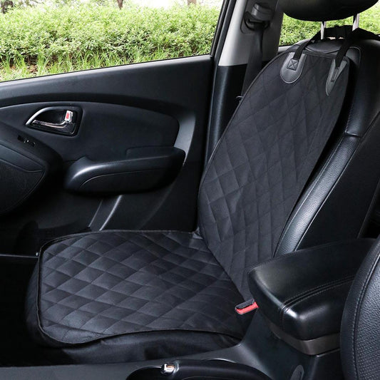 Car seat cover on a car seat with a diamond pattern, showing a clear view of the car's interior.