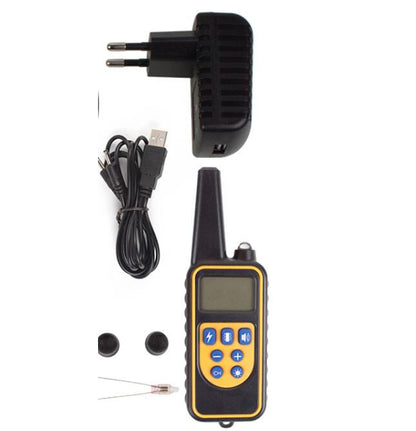 Dog training collar with charger, cable, and earbuds on a white background