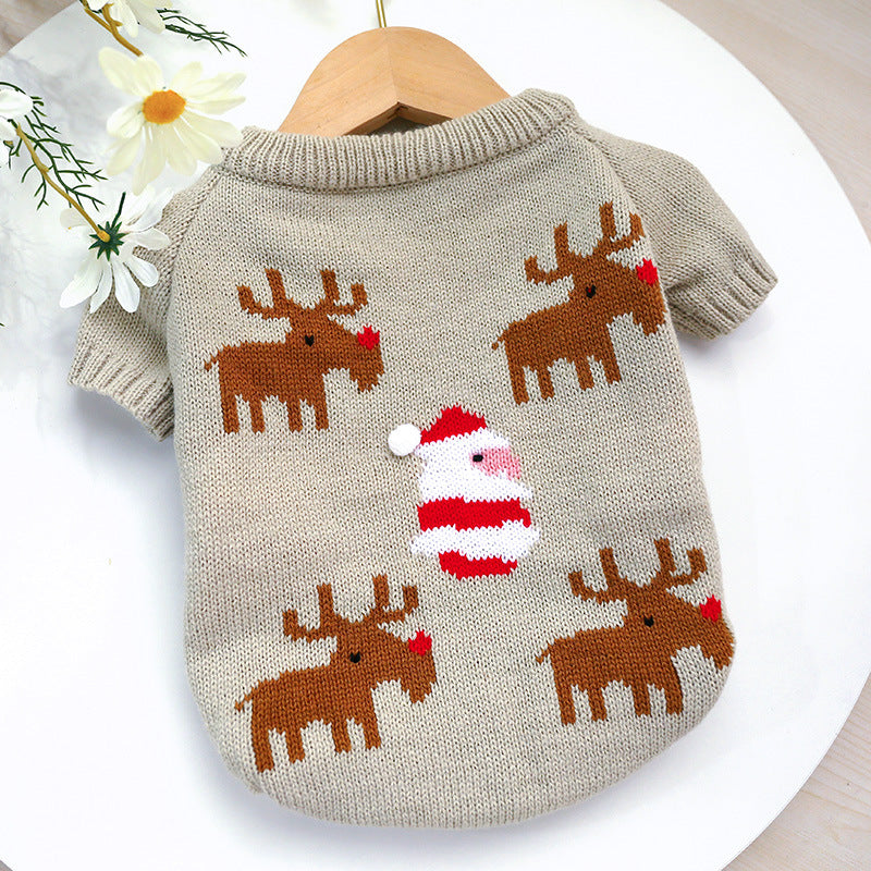 Dog sweater with reindeer and Santa Claus design on a white background