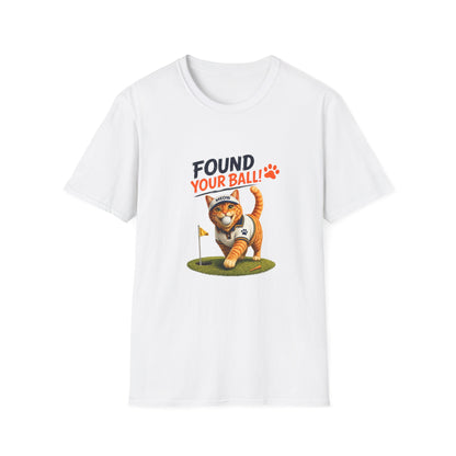 A white short-sleeve crewneck t-shirt featuring a cartoon graphic of an orange tabby cat playing golf on a green, with the text 'FOUND YOUR BALL!!' printed above it.