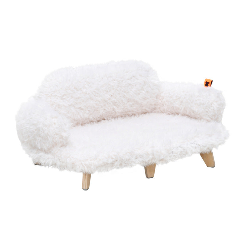 White fluffy ottoman with wooden legs on a white background