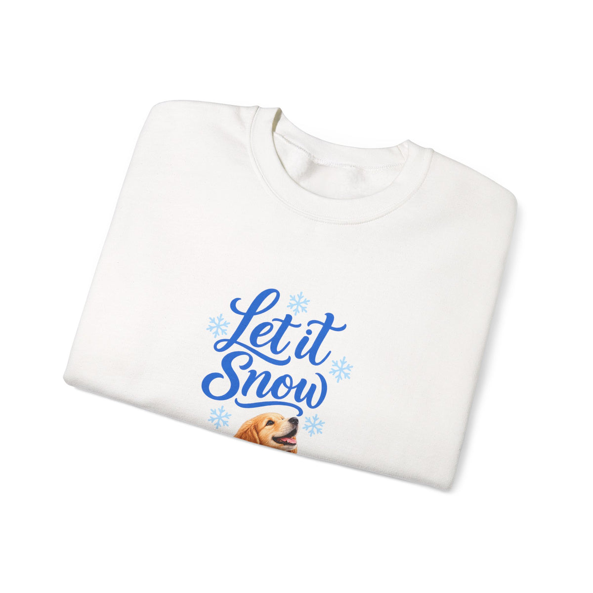 A folded white crewneck sweatshirt featuring a blue graphic that reads 'Let it Snow' in cursive, surrounded by light blue snowflakes, with   a golden retriever dog   printed below.