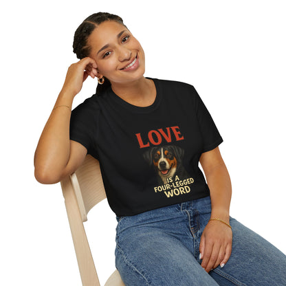 Woman wearing a black t-shirt with a graphic design sitting on a chair.