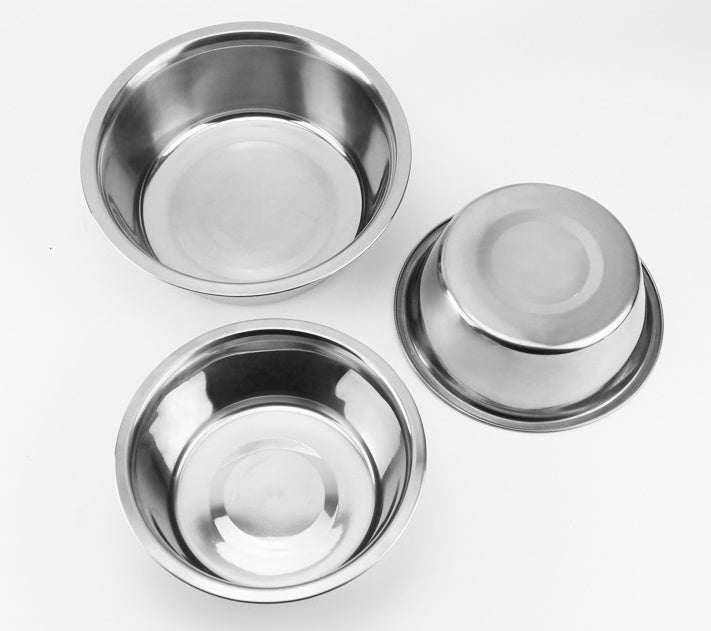 Three stainless steel bowls on a white background