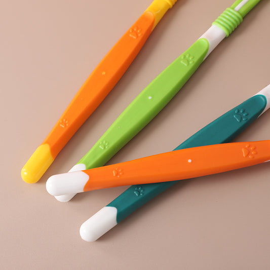Colorful baby utensils on a beige background